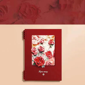 Red notebook with floral design on a beige background