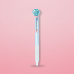 Light blue ballpoint pen with a decorative cap on a white background
