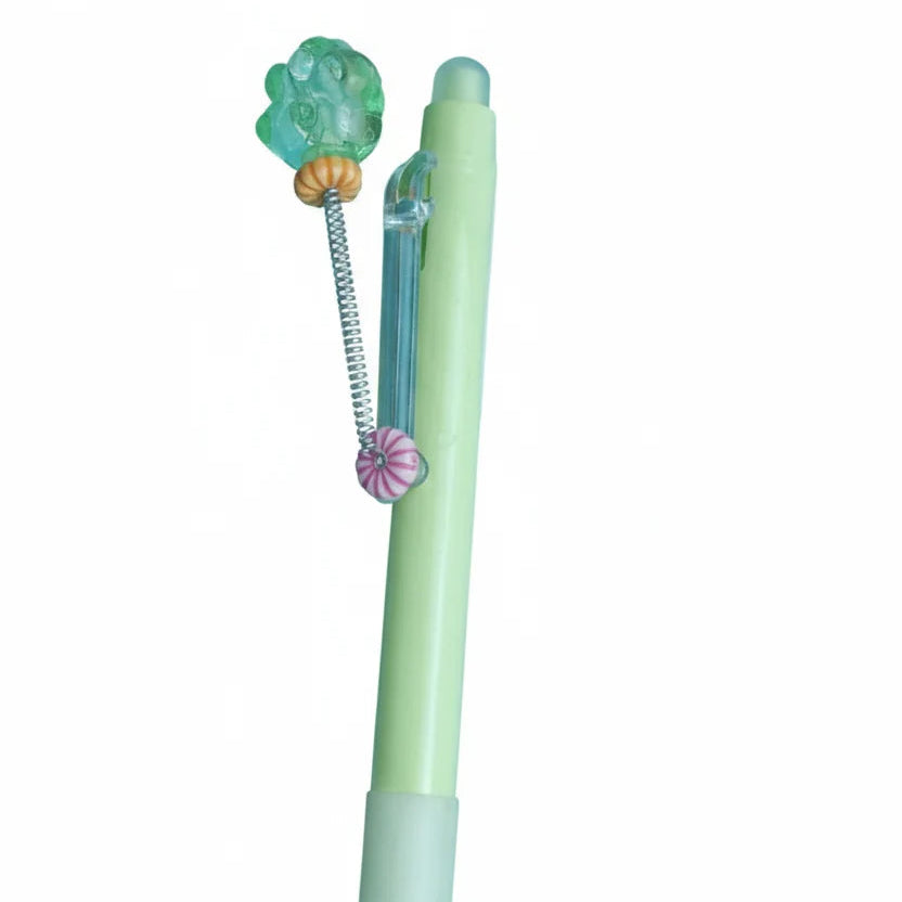Light green pen with decorative top on a white background