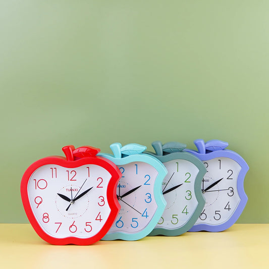Three apple-shaped desk clocks in red, blue, and green colors displaying time on their faces.