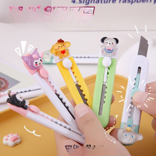 Set of stationery items including pens and a cutter with cartoon character designs on a light background.