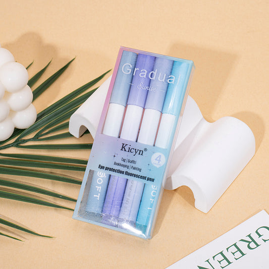 Packaged Kicyn Gradua eye protection fluorescent pens on a beige background with green leaves.