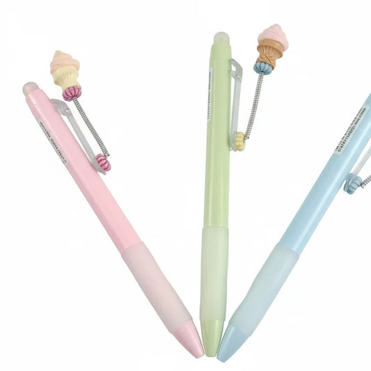 Three pastel-colored pens with ice cream cone ends on a white background
