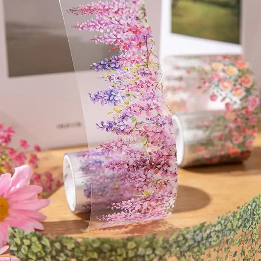 Roll of floral-patterned paper with a pink flower in the foreground