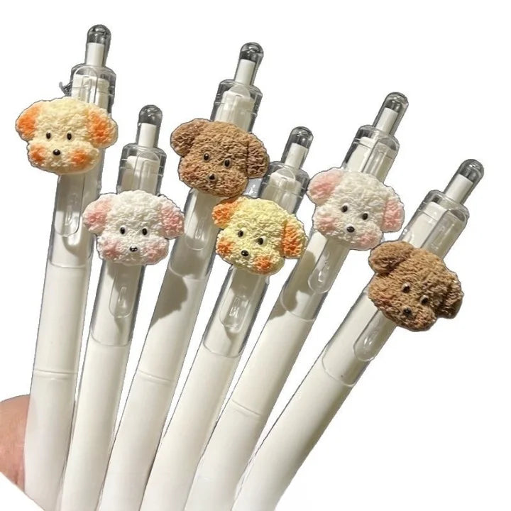 Set of pens with teddy bear-shaped tips on a white background