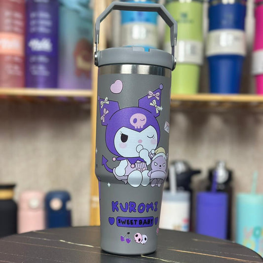 Gray tumbler with a cartoon character on a black table with colorful background