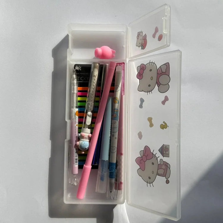 Pencil case with stationery items including pens and a ruler, featuring Hello Kitty illustrations on a white background.