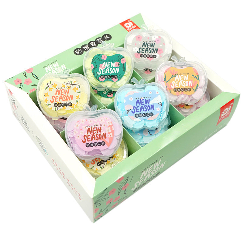 Set of colorful 'New Season' products in a box with floral designs.