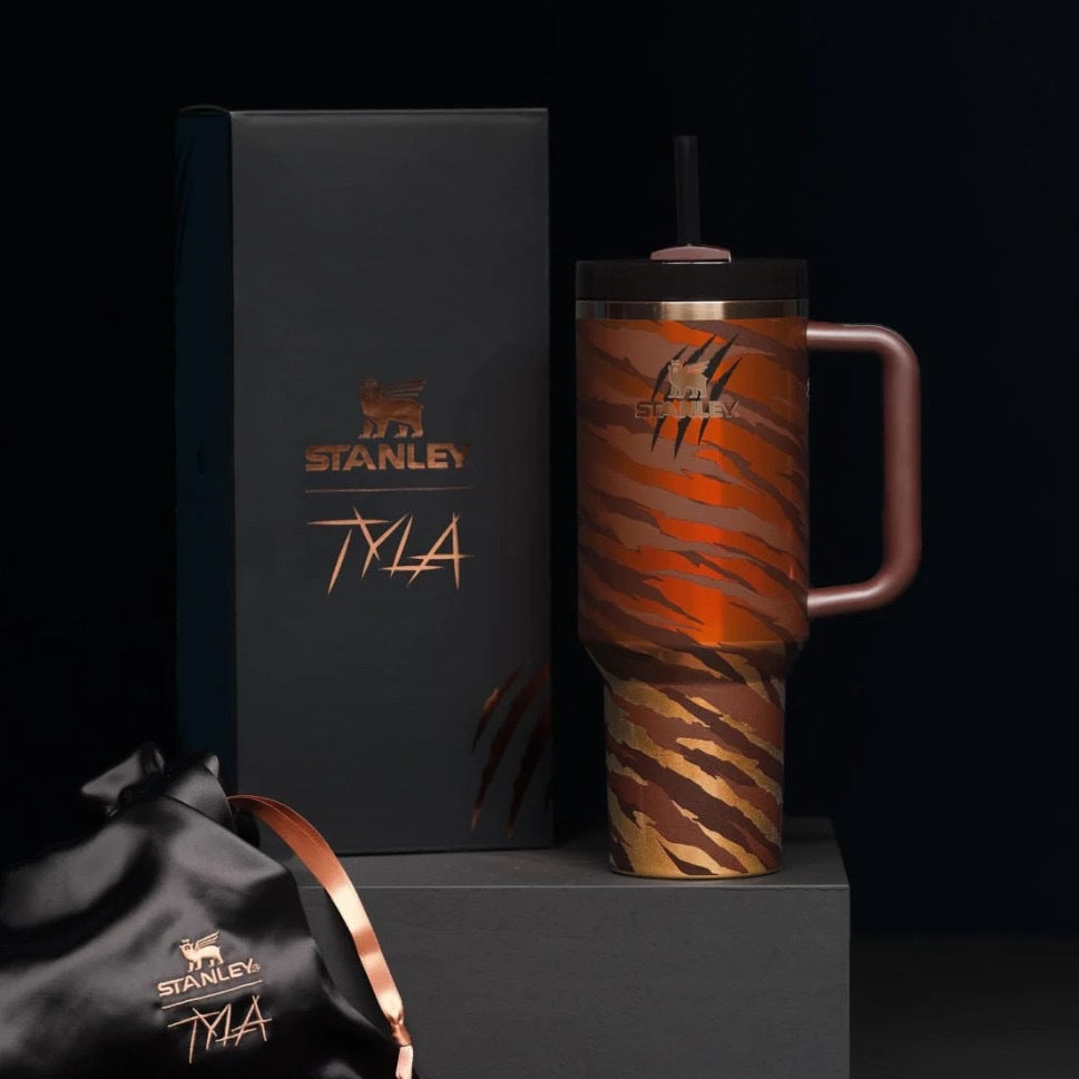 Stanley mug with tiger stripe pattern and matching box on a black background
