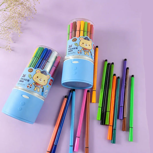 Two packs of 36-color gel pens in clear cylindrical cases with blue bases, shown alongside several loose pens in assorted colors on a pastel lavender background.