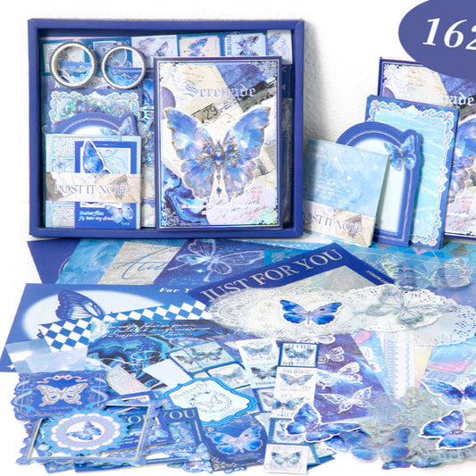 Collection of blue stationery items with butterfly designs on a white background