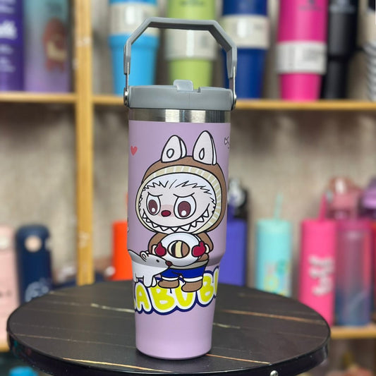 Purple tumbler with cartoon character on a wooden shelf with other colorful tumblers.