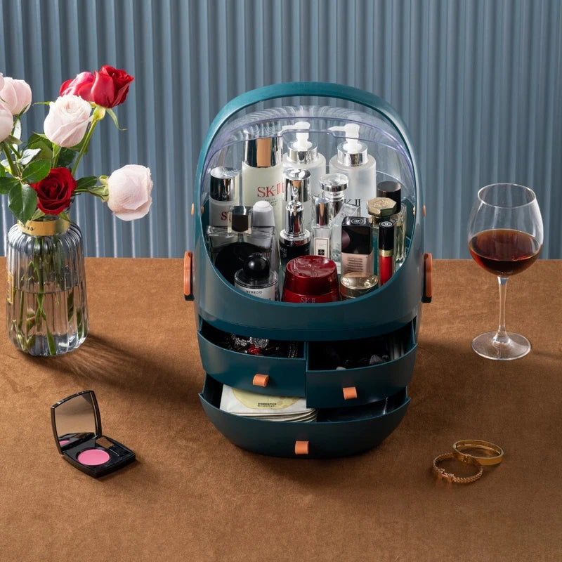 Small round cooler with drinks on a table with flowers and a glass of wine.