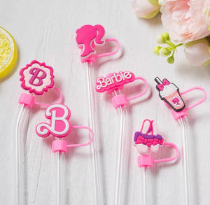 Set of pink Barbie-themed strawlers on a white background with flowers and a lemon.