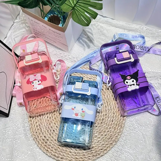 Three colorful water bottles with cartoon designs on a textured surface.