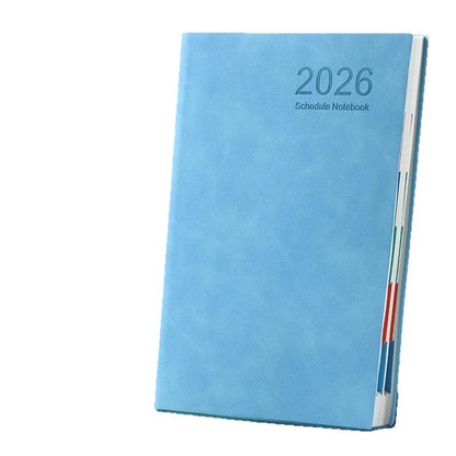 Blue schedule notebook with '2026' on a white background