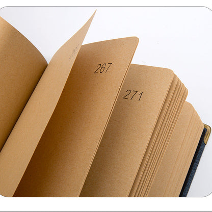 Brown notebook with pages numbered 267 and 271 on a white background