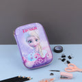 Three Frozen theme pencil cases with character illustrations, displayed alongside stationery items such as pencils and a makeup brush.