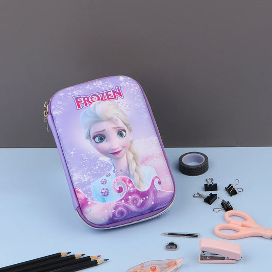 Three Frozen theme pencil cases with character illustrations, displayed alongside stationery items such as pencils and a makeup brush.