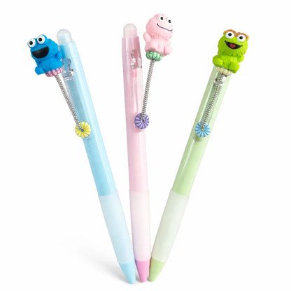 Three colorful pens with character ends on a white background