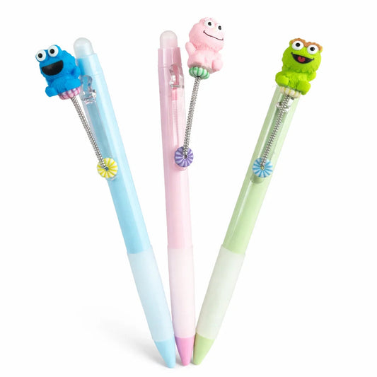Three colorful pens with character ends on a white background