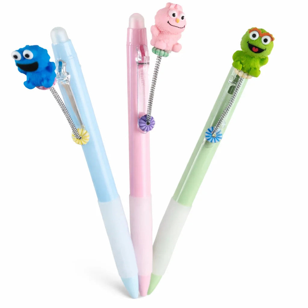 Three colorful pens with character ends on a white background