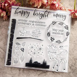 Clear stamp set with festive designs and text on a textured surface with flowers.