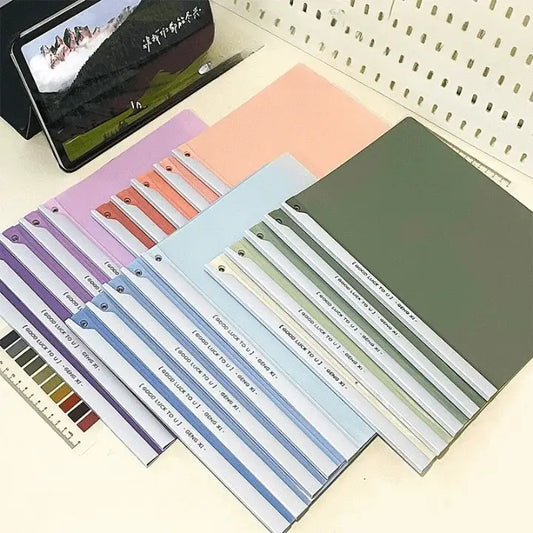 Colorful file folders with labels on a white surface