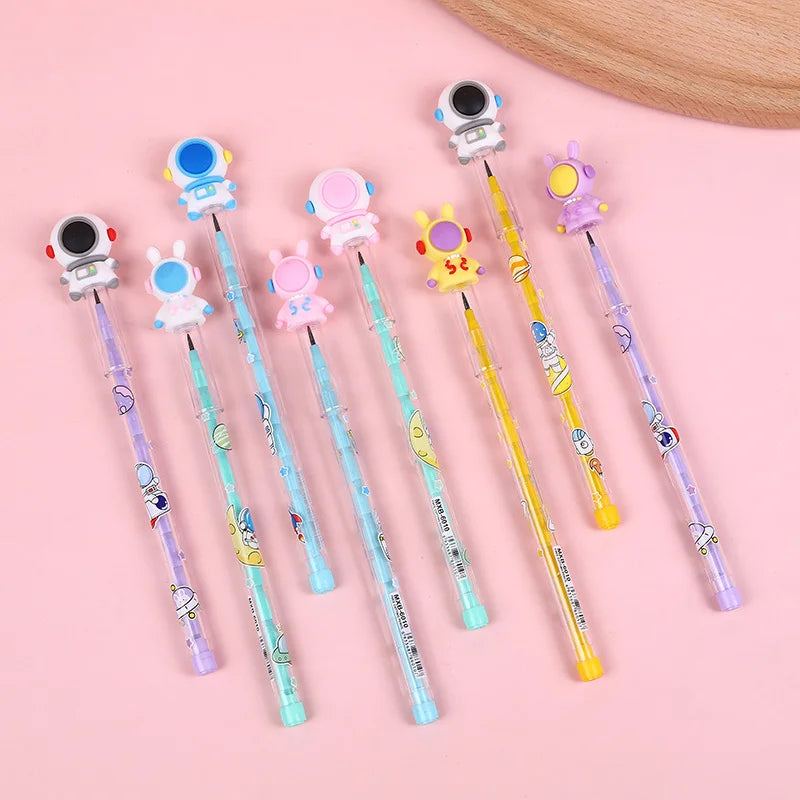 Set of colorful pens with cartoon character ends on a pink background