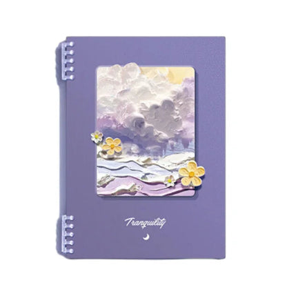 Purple notebook with a scenic cover design on a white background