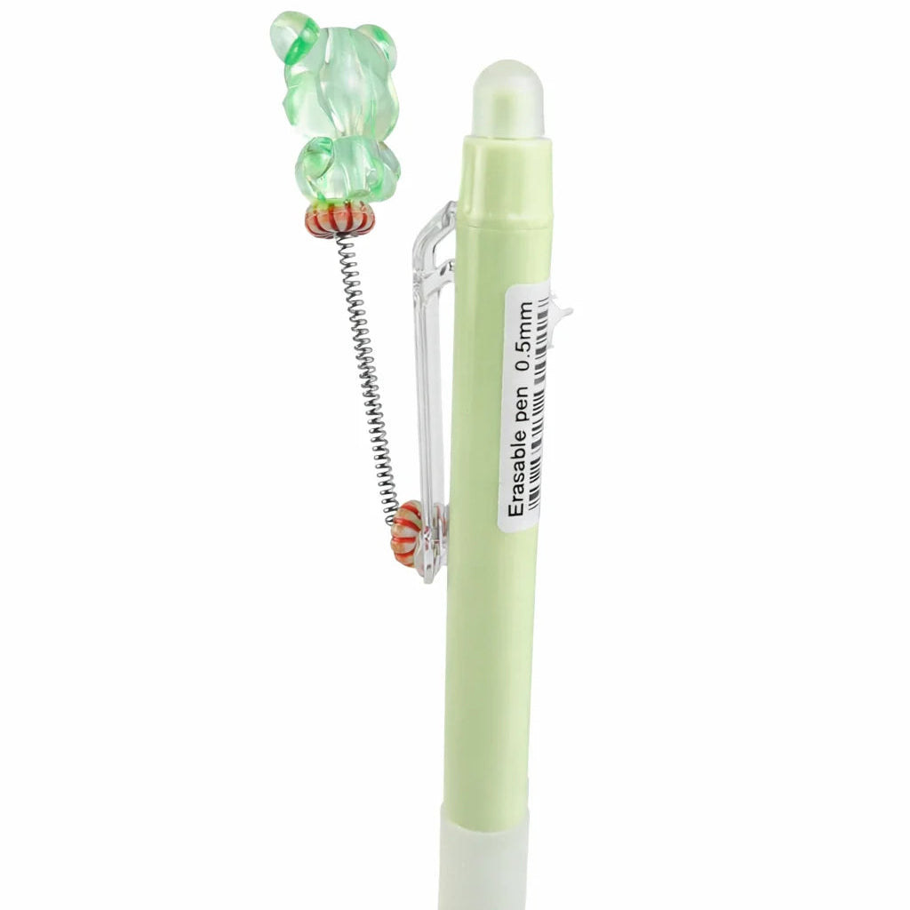 Light green pen with a small green bear-shaped eraser on a white background