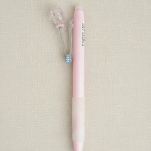 Pink pen on a beige background
