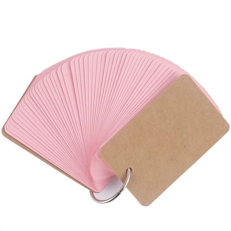 Pink fan-shaped product with a cardboard backing on a white background