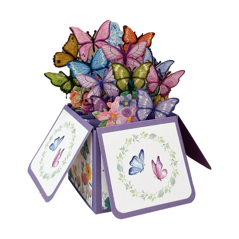 Decorative box with colorful butterflies and floral designs on a white background