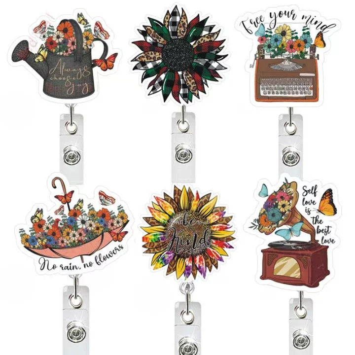 Set of decorative badge holders with various designs on a white background