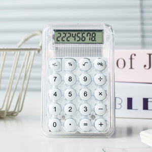 White calculator with digital display on a light surface