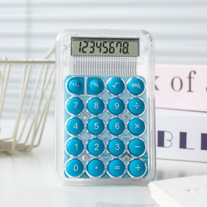Calculator with blue buttons on a white surface