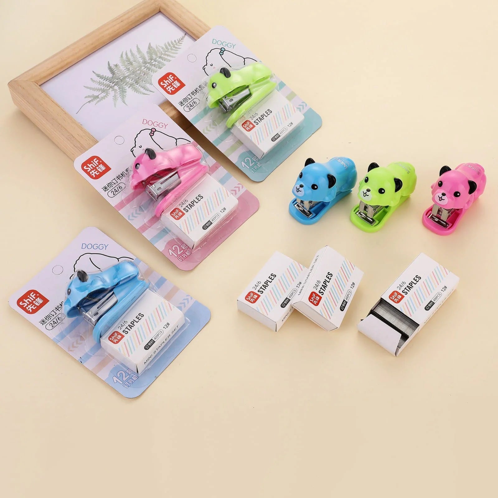 Set of colorful paper clips with cartoon designs on a beige background