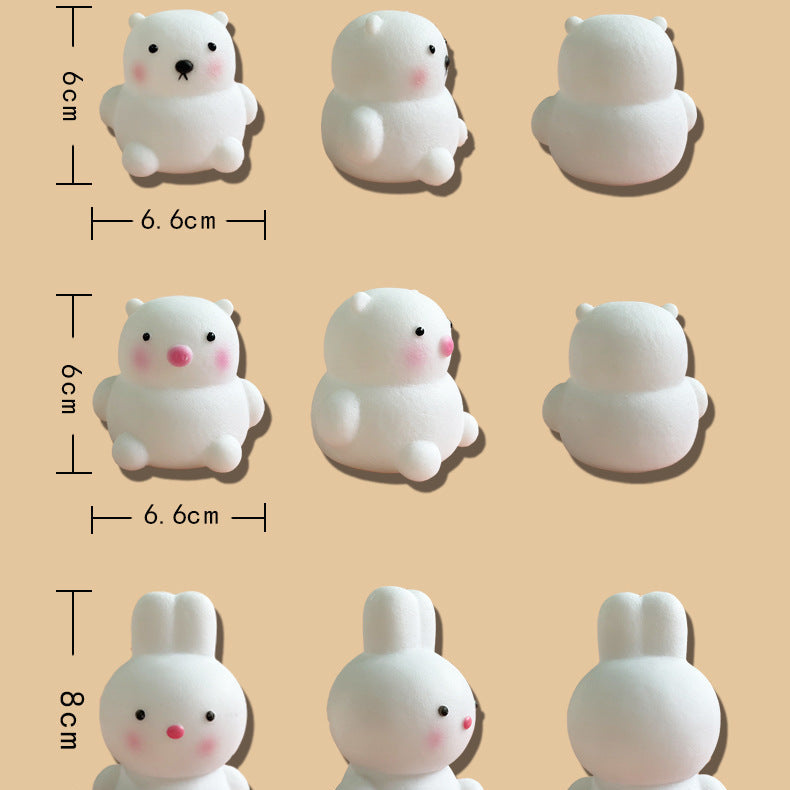 Measurement chart of various small animal figurines on a beige background