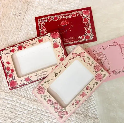 Decorative photo frames with floral designs on a textured surface