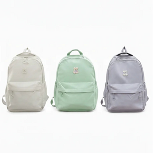 Three backpacks in light gray, mint green, and light blue on a white background