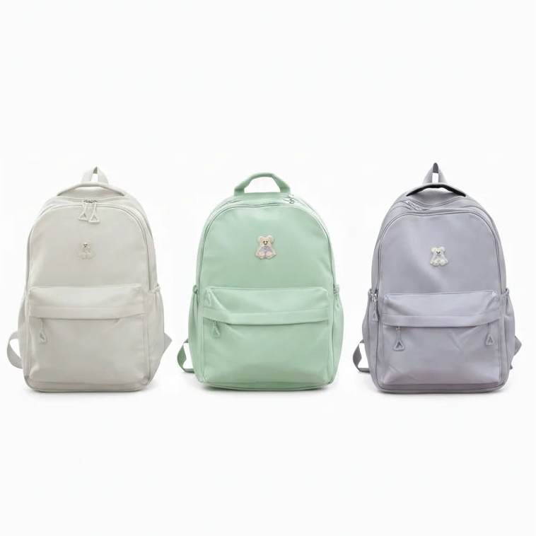 Three backpacks in light gray, mint green, and light blue on a white background