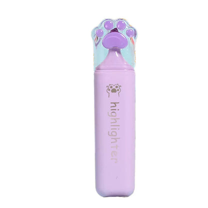 A single highlighter pen in light purple with a paw-shaped cap, shown on a plain white background with red Chinese text to the left. The cap has a holographic finish showing blue and green reflections, and the pen body has 'highlighter' printed vertically.