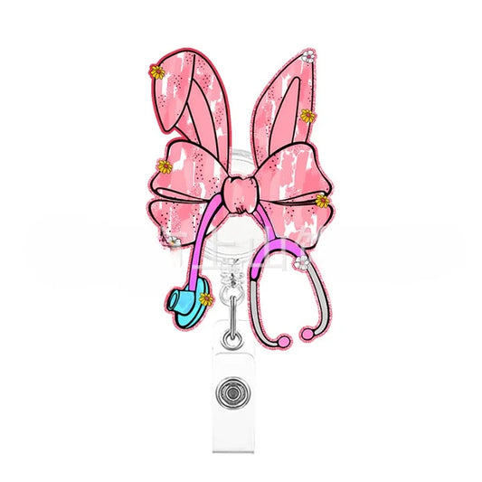 Pink bunny ears with a bow and stethoscope on a white background
