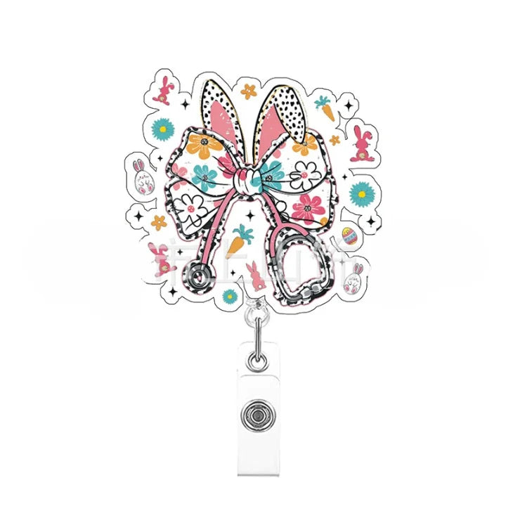 Decorative badge holder with a large bow and small illustrations on a white background