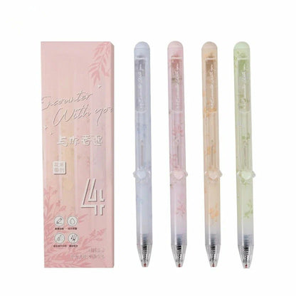 Set of four gradient pens with a pink packaging box on a white background