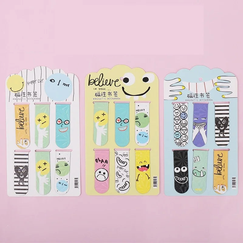 A set of six double-sided magnetic bookmarks with various funky emoji designs on each, displayed on a pink background.