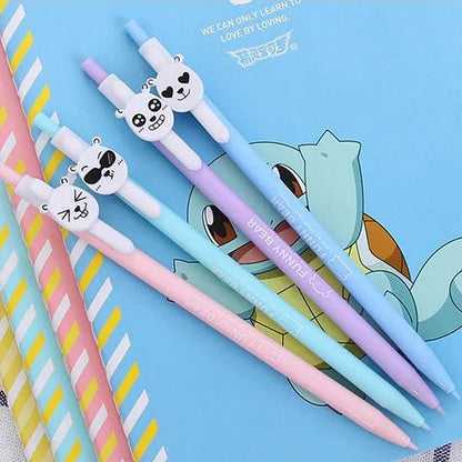 Set of colorful pens with cartoon designs on a blue card