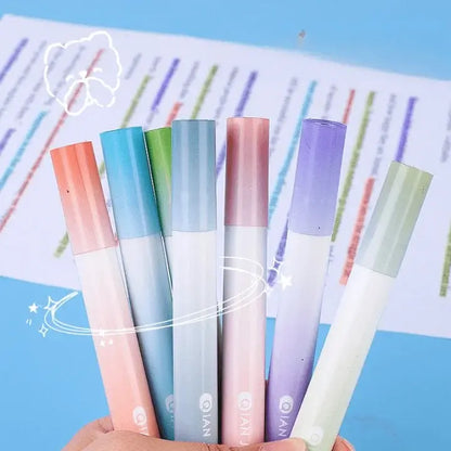 Set of colorful markers held by a hand with a colorful background