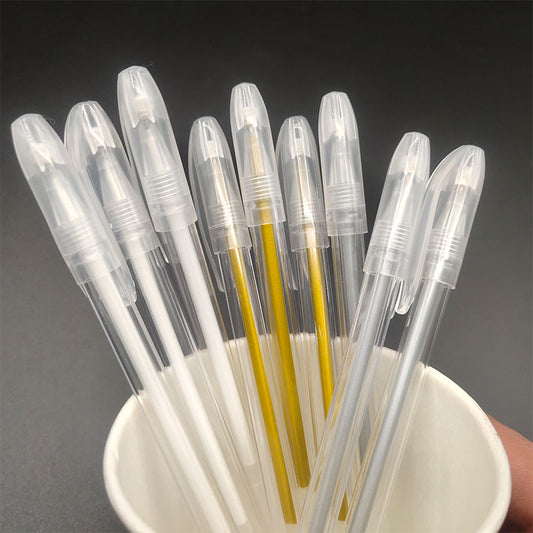 Clear plastic straws with different colored centers in a white cup against a dark background